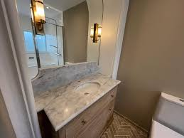 Pairing a Marble Vanity Top With Cabinets, Mirrors, and Fixtures